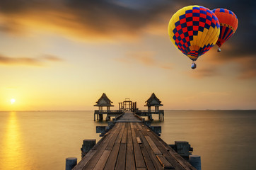 Summer, Travel, Vacation and Holiday concept - Wooden pier between sunset in Phuket, Thailand