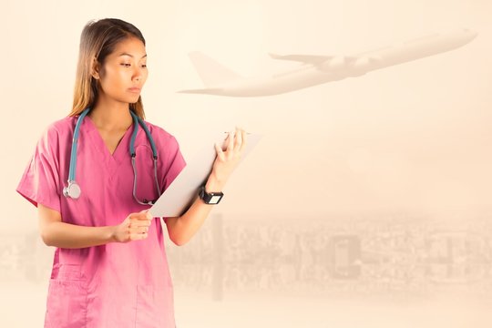 Composite image of asian nurse with stethoscope 