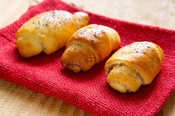 Baked croissants with poppy seeds.