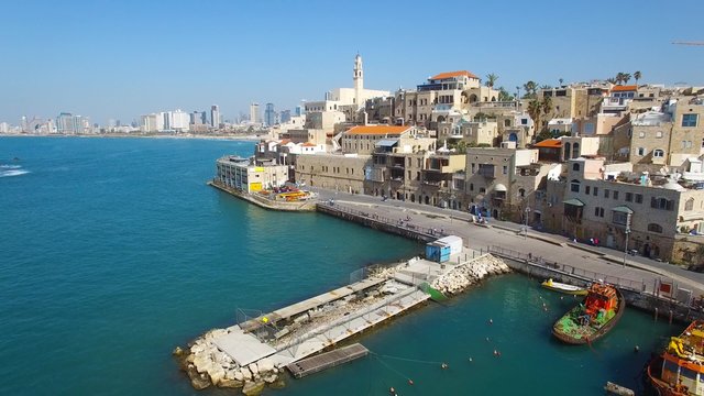 Aerial footage of the old city of Jaffa and tel Aviv skyline