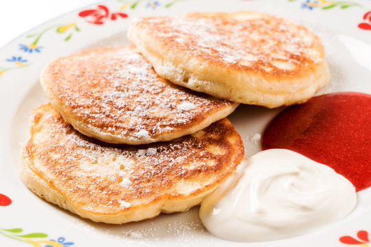 tasty pancakes with sour cream and jam