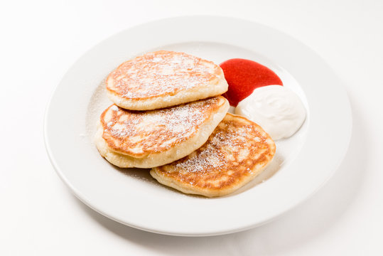 tasty pancakes with sour cream and jam