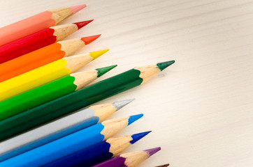 Obraz premium Coloured Pencils on a Wooden Desk