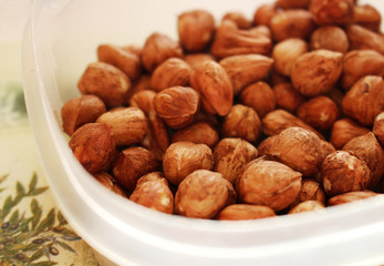 Detail of bowl with tasty and healthy hazelnuts