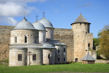 Fototapeta na wymiar Medieval churches and Gate Tower september day. Ivangorod fortress, Russia