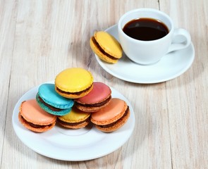 Macrons with cup of coffee