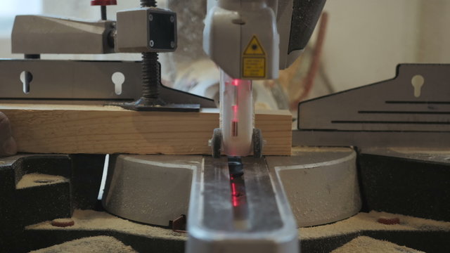 Closeup Carpenter Cutting Plank Wood by Circular Saw