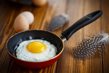 fried eggs in a frying pan