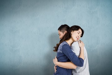 Composite image of happy couple embracing