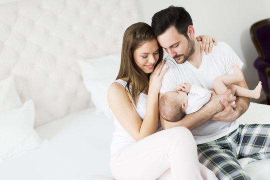 Happy family with newborn baby