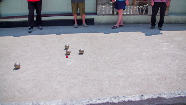 Bouling playing on sand field