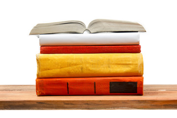 Open book, hardback books at wooden shelf isolated on white background. Back to school. Copy space for text