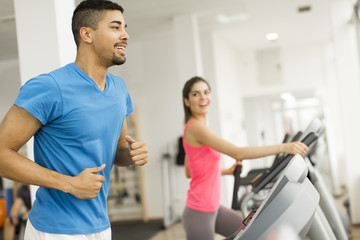 Fototapeta premium Young people training in the gym