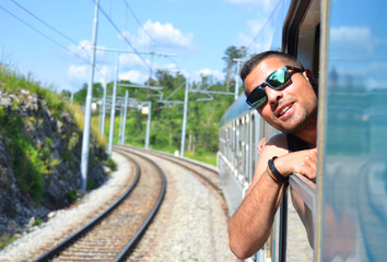 A young tourist enjoy a train ride