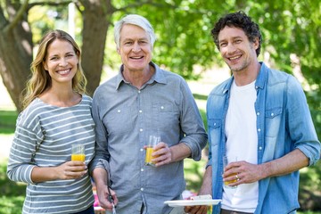 Family having a picnic with barbecue