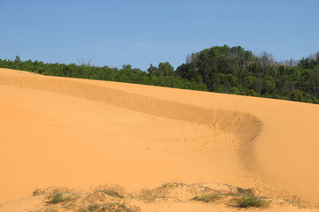 Red sand dunes near Mui Ne in a sunny day. Vietnam