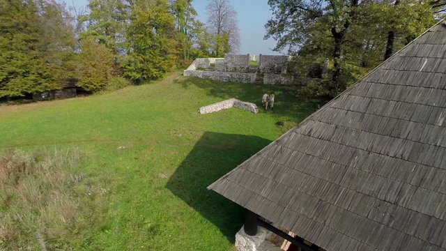 Couple hiking in the castle ruins on the hill 