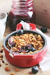 Blueberry granola crisp. Clean-eating gluten free dessert . Superfoods concept.Toned image, selective focus.