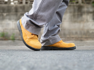Close up of safety shoes on street