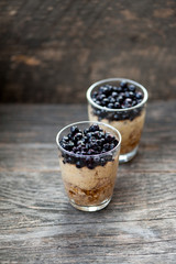 Fototapeta na wymiar Chia seeds pudding with blueberries in a glass