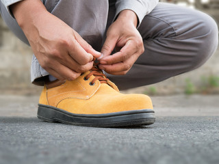 Siting to wears safety shoes