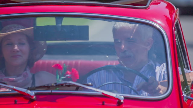Man and woman enjoying the conversation during a car ride