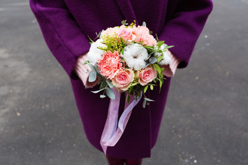 Beautiful children's bouquet in female hands