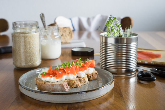 Salmon and cottage cheese sandwich served with garden cress. Selective focus.