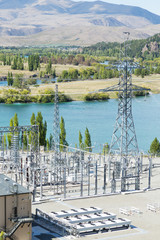 power transmission station near lake in summer day in new zealan