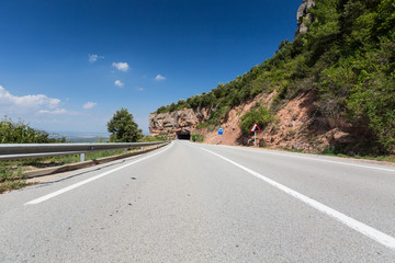 Rural road among rocks at summer