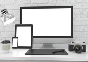 Responsive mockup screen. Monitor, tablet, phone on table in office.