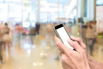 Hands using smartphone in exhibition hall
