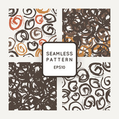 Set of vector seamless patterns with grungy hand-drawn spiral elements