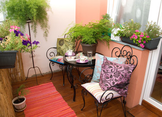 beautiful black furniture on flowery terrace