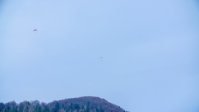 Para-gliders flaying over the mountains 