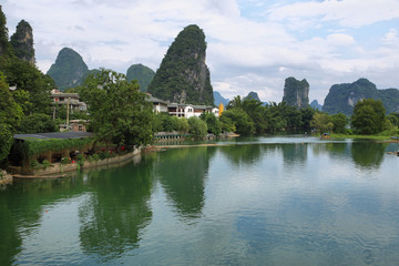 Fototapeta na wymiar Karst mountains reflected in Yulong river