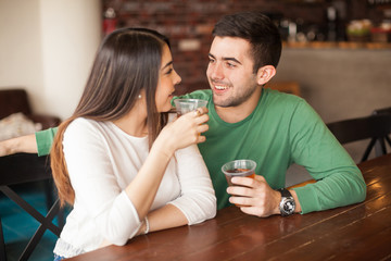 Young man flirting with a girl at the bar