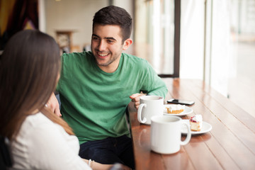 Young man with his girlfriend in a cafe