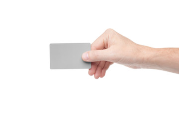 gray card in a human hand isolated on white background