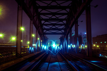 Freezelight heart on the railway bridge