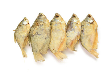 dried fish fillets skewers on a white background