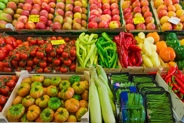 Fruits and vegetables at a farmers market.  Market stall with va