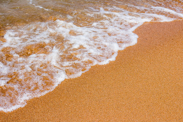 Soft wave of the sea on the sandy beach