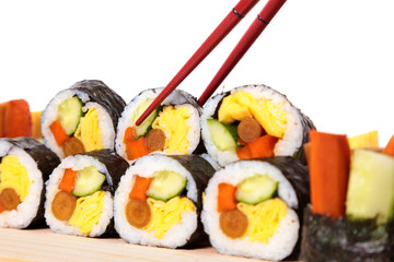 Sushi with chopstick on white background