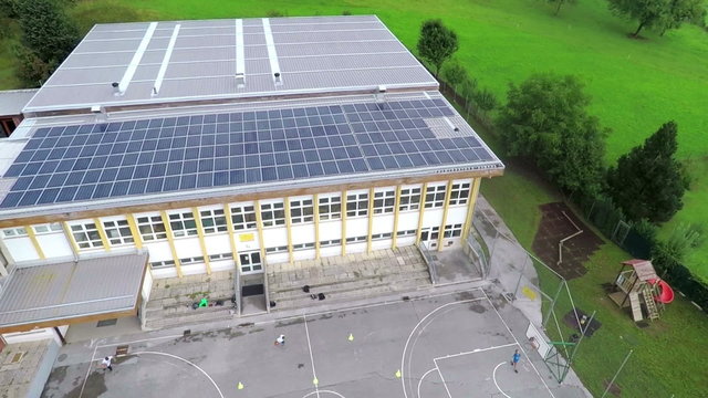 Air view on old building which has solar panels 