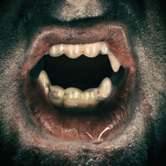 Vampire Mouth. Horror male vampire portrait, edited with vintage film effects.