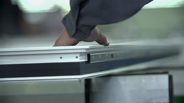 Man screws a screw into fetters