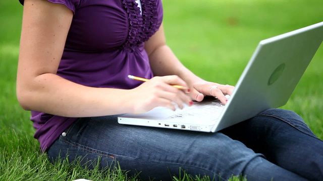 Closeup of college student studying outdoors
