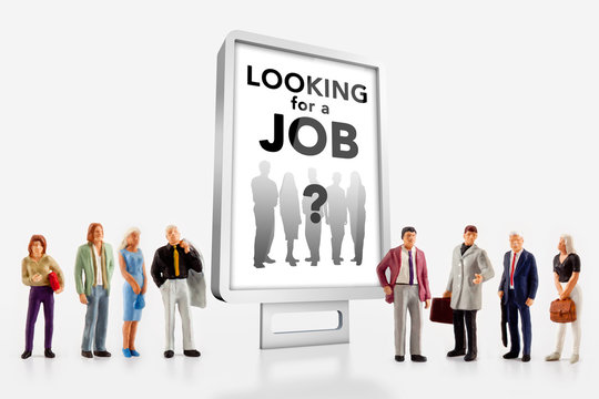 miniature people  - people standing in front of a job recruitment billboard