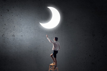 Woman touch the moon